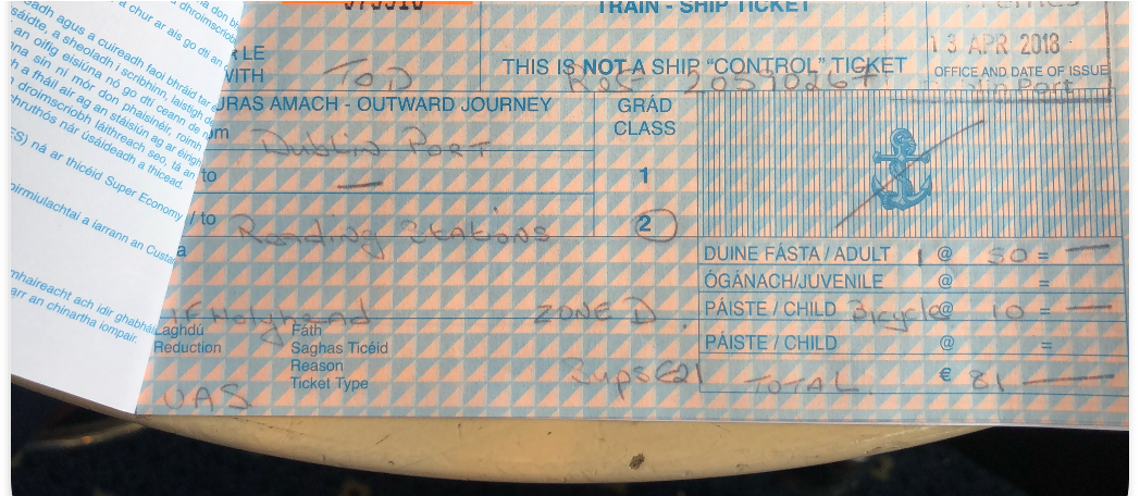 A photo of an old style sailrail ticket which is handwritten